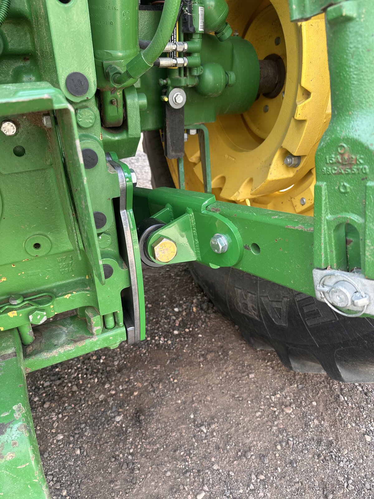 RollerGlide Six bearing bracket close-up — John Deere 6-series 3-point hitch stabilization