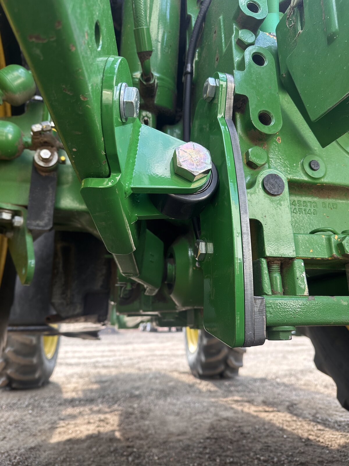 RollerGlide Six precision-fit bracket with cam follower bearing — John Deere 6M sway block roller
